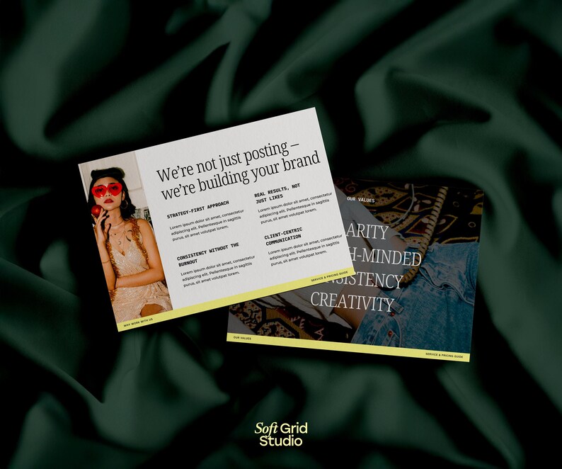 May include: Two business cards on a dark green fabric background. The cards feature text that reads "We're not just posting - we're building your brand." One card has a photo of a person wearing red heart-shaped sunglasses. The other card has the words "Clarity, High-Minded, Consistency, Creativity."