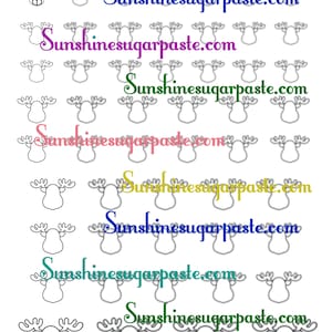 May include: A sheet of royal icing transfers with reindeer designs. The sheet features multiple outlines of reindeer heads with antlers. The text "Sunshinesugarpaste.com" is repeated in various colours across the sheet.