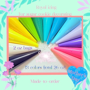 May include: A set of 13 colors of royal icing in 2 ounce bags, for decorating sugar cookies. The icing is labeled "Sunshine Sugar Paste" and is made to order. The colors include yellow, green, blue, purple, pink, and more.