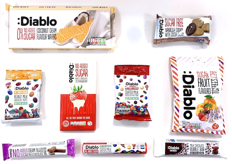 May include: An assortment of sugar-free Diablo chocolate and candy products, including wafers, chocolate bars, coated milk chocolate buttons, peanut milk chocolate treats, fruit flavored toffee, and a vanilla cookie with cocoa chips.