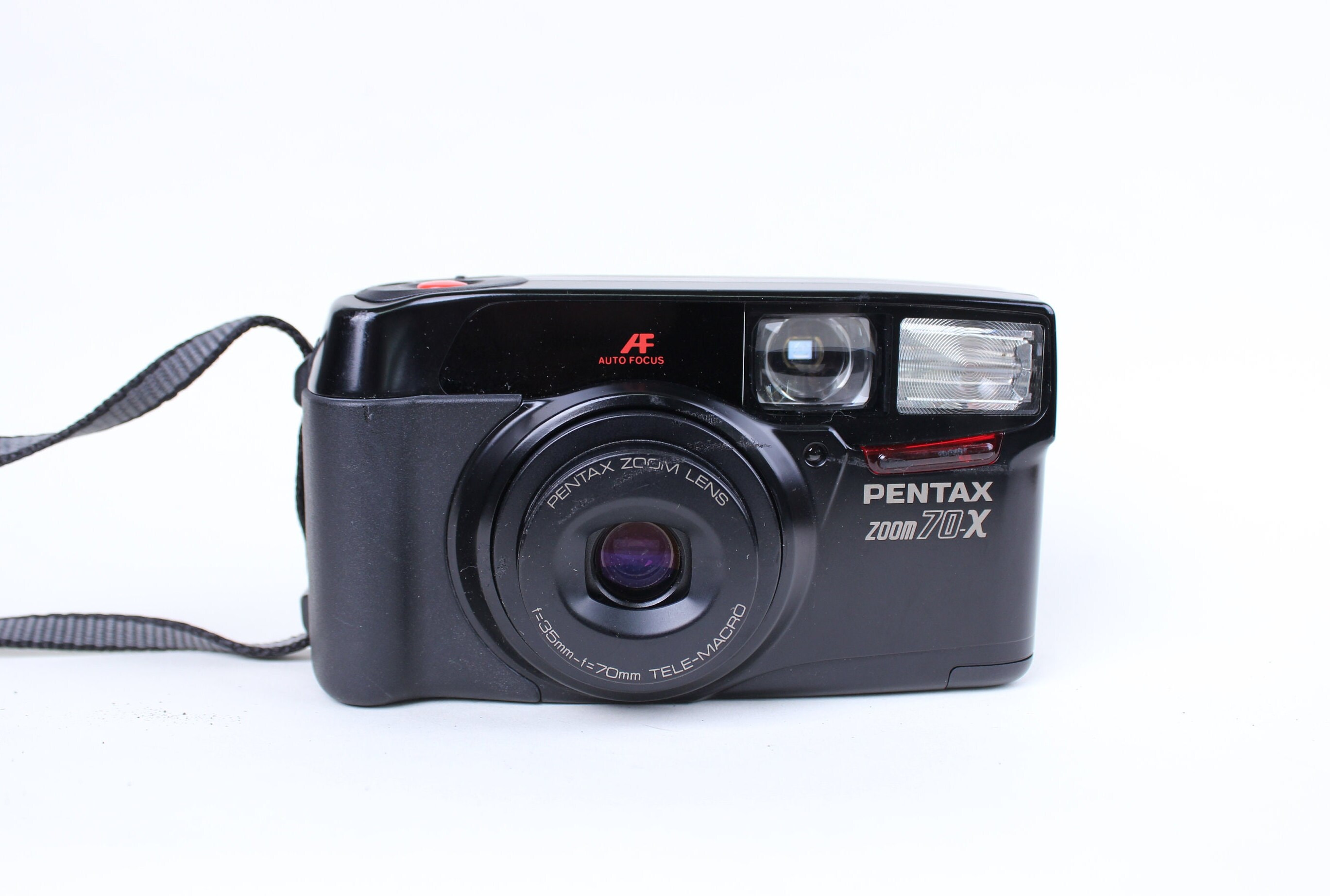 Lens 35-70 mm Tele-Macro Working Film Camera. Film Camera Pentax Pentax Zoom 70-S Point and Shot Camera Lens 35-70 mm Tele-Macro Working Film Camera. Film Camera Pentax Pentax Zoom 70-S Point and Shot Camera