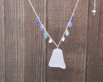 Patterned white pendant sea glass necklace with blue drops