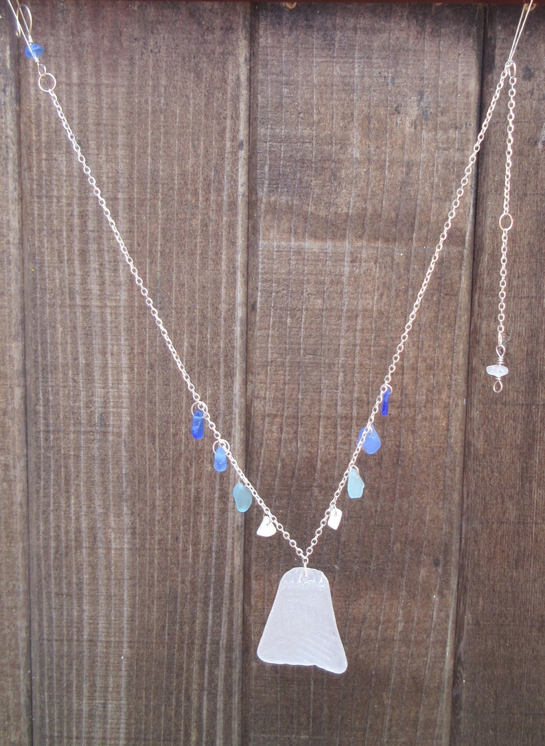 Patterned white pendant sea glass necklace with blue drops image 1