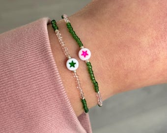 Set of 2 WICKED BEAD bracelets on elastic string. Wicked inspired bracelets. Summer friendship bracelets. Star bead.