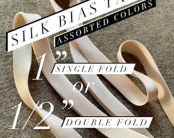 Assorted colors • 100% silk charmeuse satin bias tape • 1 inch single fold or half inch double fold • By the yard