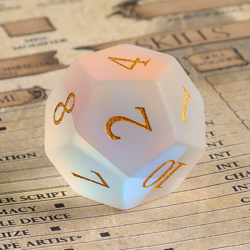 May include: A frosted, iridescent D20 die with gold-colored numerals. The die is a polyhedron with twenty faces, each marked with a number. The background is a character sheet, suggesting a role-playing game theme.