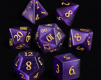 May include: Set of eight purple dice with gold numbers. The dice are made of a translucent material and have a slightly iridescent finish.