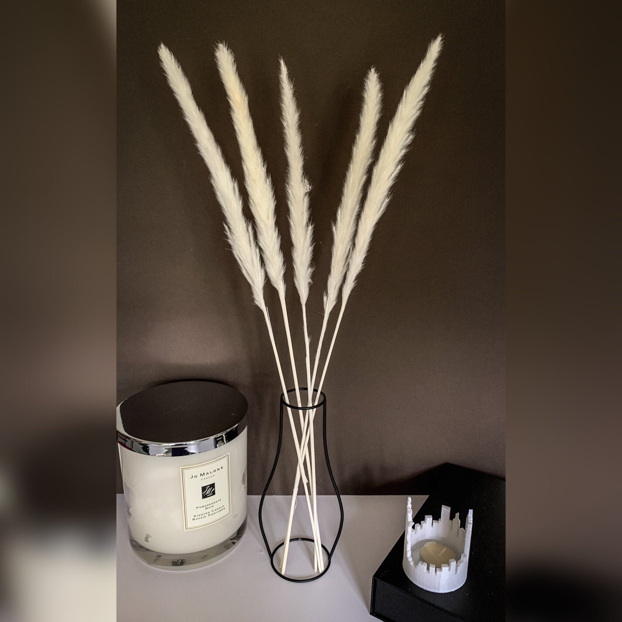 large black vase with pampas grass