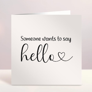 Tarjeta con el mensaje "Alguien quiere decir hola", anuncio de embarazo, tarjeta de ecografía de bebé, foto de ecografía, revelación de un nuevo bebé, tarjeta personalizada, cualquier texto, Irlanda, irlandés
