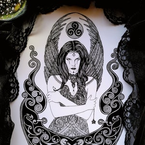 May include: Black and white ink drawing of a woman with wings, wearing a crown and a necklace. She is surrounded by intricate Celtic knotwork and a triskelion symbol.