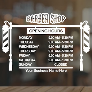 May include: A white sign for a barber shop, featuring the text "BARBER SHOP" at the top. The sign displays opening hours, from 9:00 AM to 5:30 PM, Monday to Friday, 9:00 AM to 1:30 PM on Saturday, and closed on Sunday. Includes space for a business name.