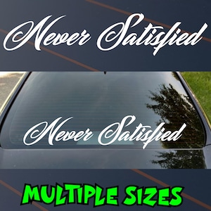 May include: White vinyl decal with the words "Never Satisfied" in a cursive font. The decal is shown on a car window. The text "MULTIPLE SIZES" is in green at the bottom.