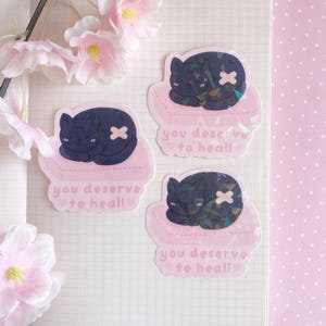 Chat noir guérisseur découpé holographique | Santé mentale citation motivation ED SH rétablissement rappel vinyle holo ordinateur portable autocollant kawaii mignon