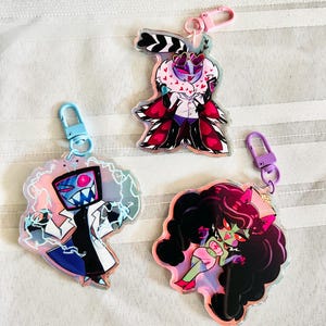 Hazbin Hotel Vox, Velvette, Valentino Halloween Collection Charms and Standees