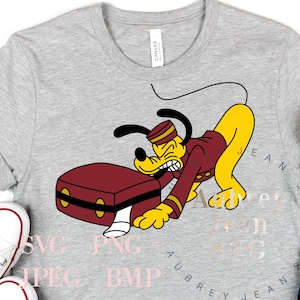 May include: A grey t-shirt featuring a cartoon image of Pluto dressed as a bellhop carrying a suitcase. The text "Adventure is Calling" is printed on the shirt.