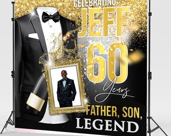 May include: A black and gold birthday backdrop with a tuxedo, a champagne bottle, and a photo of a man in a tuxedo. The backdrop says "Celebrating Jeff 60 Years Father, Son, Legend".