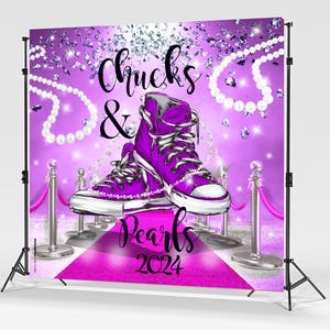May include: Purple and silver backdrop with the text "Chucks & Pearls 2024". Two purple high-top sneakers with white laces and a pearl necklace are on a pink carpet with silver stanchions.