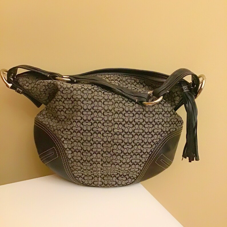 black coach purse with silver c's
