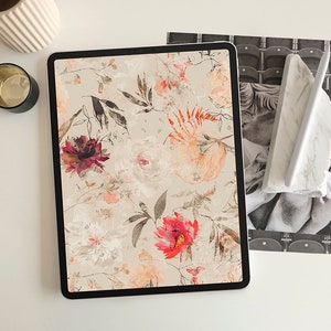 May include: A digital tablet displaying a floral pattern with red, pink, and orange flowers on a beige background.