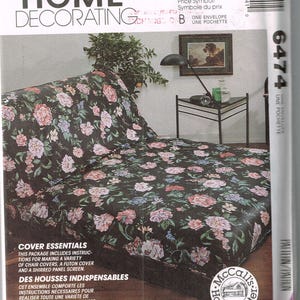May include: McCall's Home Decorating pattern with a floral futon cover design. The pattern includes instructions for chair covers and a shirred panel screen. The cover has a dark background with pink, blue, and white flowers.