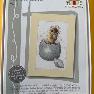 May include: A cross-stitch card kit featuring a baby bird hatching from an egg. The kit includes pre-sorted cottons and an envelope. The finished design size is 4 inches by 6.3 inches. The kit is titled "Peek-a-boo" and designed by Hannah Dale.