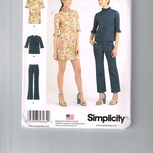 May include: A sewing pattern for a dress and pants. The pattern is for sizes 4-12. The dress is a floral print and the pants are a solid blue. The pattern is from Simplicity and is designed by Cynthia Rowley.