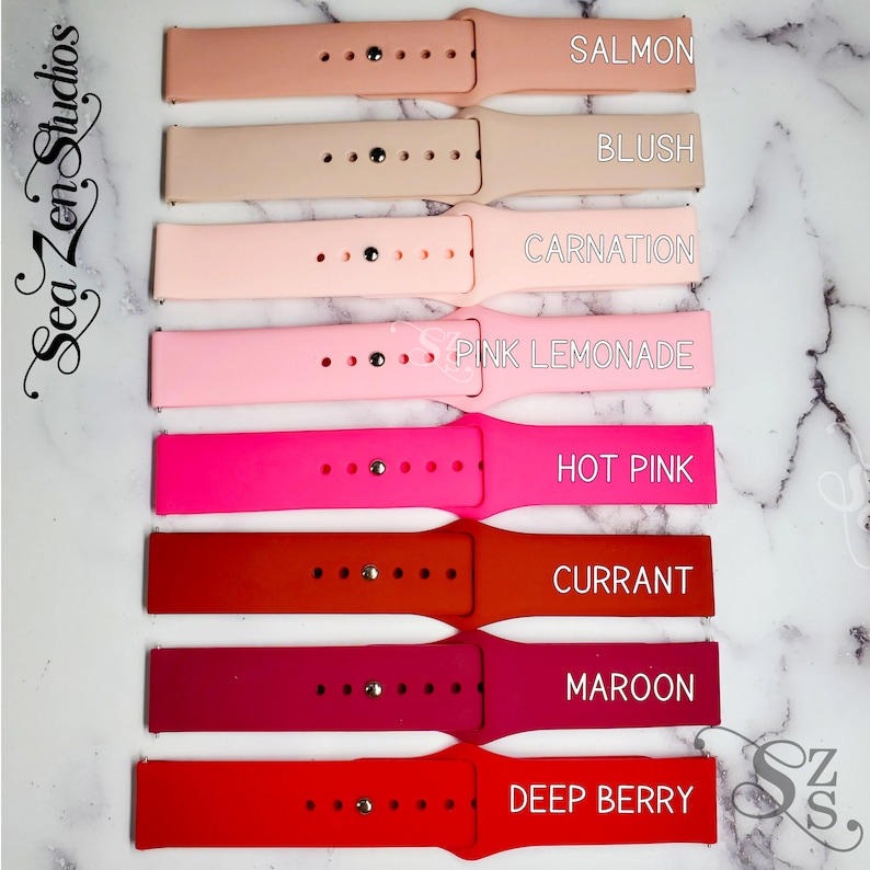 May include: Eight silicone watch bands in various shades of pink and red. The bands are labeled with the following colors: Salmon, Blush, Carnation, Pink Lemonade, Hot Pink, Currant, Maroon, and Deep Berry.