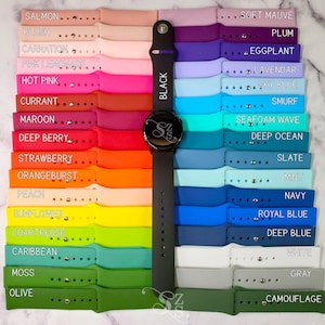 May include: A variety of colorful silicone watch bands for a smartwatch. The bands are arranged in rows, with the colors ranging from salmon to olive. The bands are all 20mm wide and are compatible with most smartwatches.