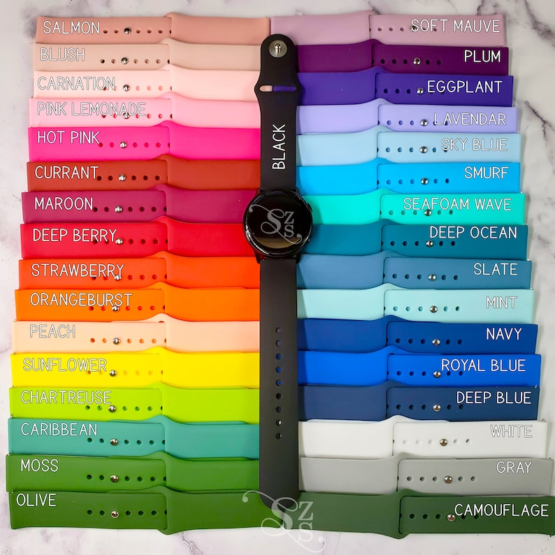 May include: A variety of colorful silicone watch bands for a smartwatch. The bands are arranged in rows, with the colors ranging from salmon to olive. The bands are all 20mm wide and are compatible with most smartwatches.