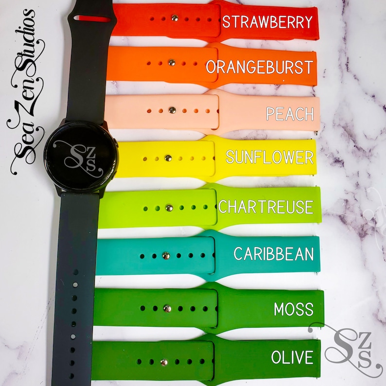 May include: A set of eight silicone watch bands in various colors, including olive, moss, caribbean, chartreuse, sunflower, peach, orangeburst, and strawberry. The bands are arranged vertically, with the darkest color at the bottom and the lightest color at the top. The bands are all the same size and have a similar design.