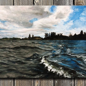 May include: A painting of a lake with choppy water and a distant shoreline with trees. The sky is a mix of blue and gray with clouds.