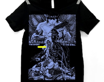 May include: Black t-shirt featuring a blue and white graphic from "Ghost in the Shell." The design includes two figures, futuristic cityscapes, and the text "THE GHOST IN THE SHELL."