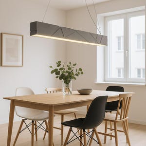 Pendant light with a metallic surface and soft light
