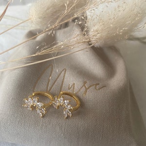Gold plated sterling silver cubic zirconia floral huggie earring (single or pair)