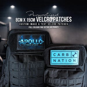 May include: Two black backpacks with personalised 8cm x 15cm Velcro patches. One patch displays "APOLLO FITNESS STUDIO" in blue, and the other says "CARB NATION" in white. The image also includes text that says "Personalised 8CM X 15CM VELCRO PATCHES".