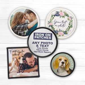 May include: A selection of iron-on patches, including circular and square designs. One patch shows a couple with the text "Keswick 2021." Another has a floral wreath and the text "Your text or photo." Other patches feature photos of a dog and a man, and a dog portrait.
