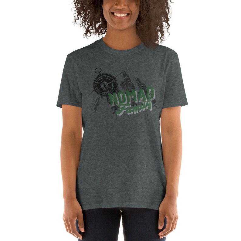 May include: A heather gray t-shirt with a graphic of a compass, mountains, and the text "Nomad Family".
