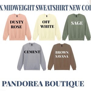 a collection of five midweight sweatshirt designs in various colors, including dusty rose, off white, sage, cement, and brown savana. The sweatshirt designs are arranged in a grid format, showcasing the different color options available.