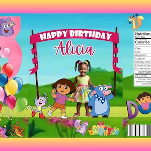 May include: A colorful birthday-themed graphic featuring the text "HAPPY BIRTHDAY Alicia" above a young girl and cartoon characters. Balloons, a large number 3, and the word "DORA" are also visible. A nutrition facts label is included.