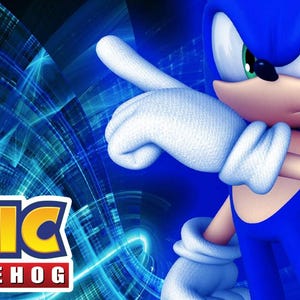 May include: A digital illustration of Sonic the Hedgehog, a blue anthropomorphic hedgehog, pointing with his right hand. The image features the Sonic the Hedgehog logo in the lower left corner against a blue and black background.