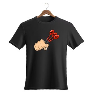 May include: Black t-shirt featuring a cartoon graphic of a clenched fist holding three red darts. The darts have black shafts and red flights. The design is centered on the chest of the shirt.