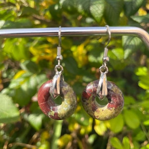 Enchanting Elegance: Dragons Blood Jasper Crystal Doughnut Drop Earrings in Silver Tone