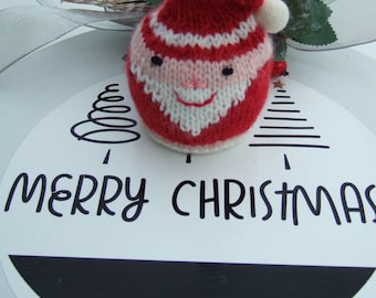 This is a Digital Knitting Pattern of a Father Christmas Chocolate Orange Cover