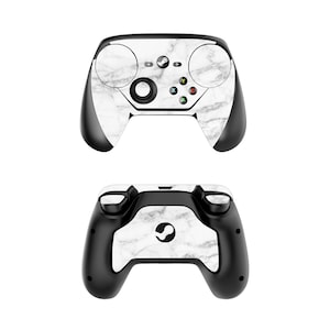 Puede incluir: Un mando Steam blanco y negro con un patrón de mármol. El mando se muestra desde el frente y la parte posterior.