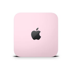 Puede incluir: Un pequeño dispositivo cuadrado de color rosa con un logotipo de Apple negro en el centro.