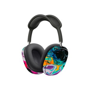 May include: A pair of black over-ear headphones with a colourful abstract design. The design features swirls of blue, green, pink, orange, and yellow.