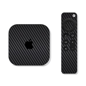 May include: A black Apple TV 4K with a carbon fiber skin and a matching black remote control.