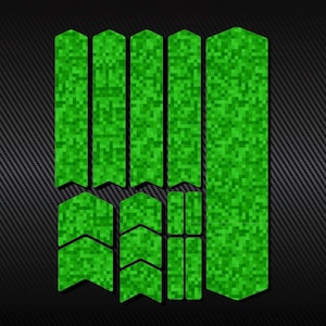 May include: Green bike frame protection stickers with a pixelated pattern. The stickers are shaped like arrows and rectangles.