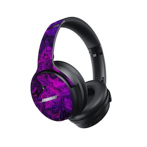 May include: Purple and black headphones with a swirling pattern on the earcups. The headphones have a black headband and earcups with a purple and black swirling pattern. The brand name "Bose" is visible on the earcup.