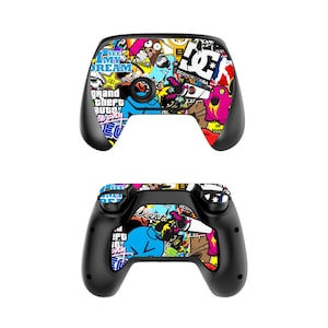 May include: A black video game controller with a colourful sticker design featuring logos and graphics. The controller has a black and white sticker with the text "See My Dream" and another sticker with the text "Grand Theft Auto: Vice City".